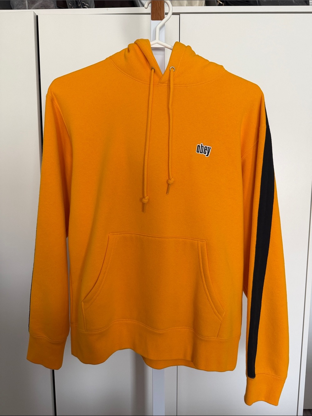 Obey Men's Orange Hoodie with Black Sleeve Stripe Detail